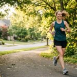 Mom practicing heat-smart running during an early morning summer run